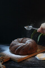 Wall Mural - Bundt cake, pound cake on  a black background