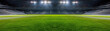© tonstock - Brightly lit empty soccer stadium with lush green field and rows of empty seats, ready for an exciting game under the night sky.