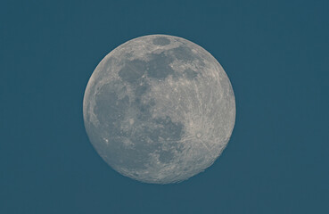 Wall Mural - Full Moon shining bright in the clear night sky, revealing its celestial beauty and ethereal glow