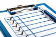 © Neha - Close-up of a checklist on a clipboard, representing organization, task management, and progress tracking