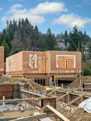 Wall Mural - Wooden frame of new house with concrete filled fundation in front