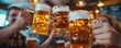 © peppastocker - Group of friends in lederhosen and dirndls toasting with large steins.