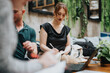 © qunica.com - Young business entrepreneurs discussing plans and taking notes during an outdoor meeting in a relaxed environment.