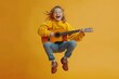 © Shah Mosaic - Jumping child playing guitar and singing on a yellow background created with Generative AI technology, Generative AI