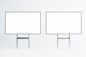 Wall Mural - Two blank whiteboards on easels in a modern interior room. 3D Rendering