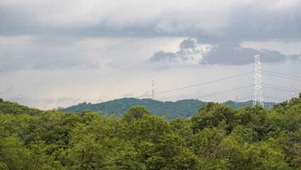 power lines in the mountains, And the scenery of the sky and the forest