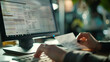 © Suriyo - Closeup hand using computer preparing invoices billing
