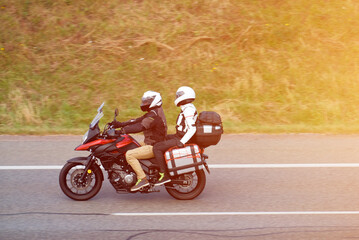 Two Motorcyclists On Touring Bike With Travel Luggage Attached