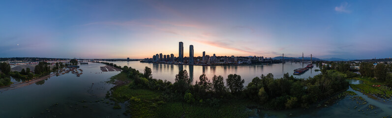 Wall Mural - Aerial Panoramic View of River and City Buildings at Twilight.