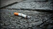 © Konstiantyn Zap - Discarded Cigarette Butt on Concrete Urban Pollution Concept