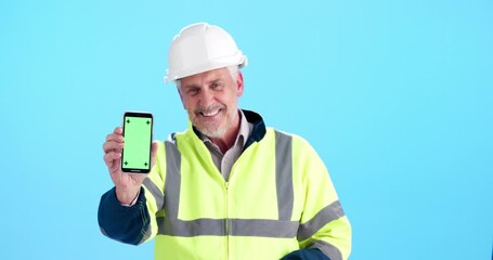 Wall Mural - Face, green screen and man with smartphone, engineering or bonus on blue studio background. Maintenance, ux presentation or person with cellphone, tracking markers and celebration for construction