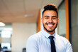 © Antonio - Portrait of a smiling young hispanic businessman in office. Corporate environments, leadership, latino and modern workplace culture