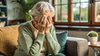 © Танюша Коновал - Sad senior woman sitting alone with hands covering face