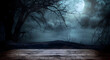 © Daniel - Old wood table and silhouette dead tree at night for Halloween background.