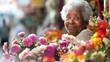 © Jafree - Elderly African American woman surrounded by colorful flowers in a flower shop. Concept of senior florist, flower market, gardening, small business