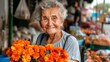 © Jafree - Elderly Caucasian woman holding fresh orange flowers at a farmers market. Concept of senior citizen, floriculture, local produce, outdoor shopping