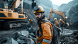 © Natalia - Male construction worker wearing a yellow hard hat and orange reflective jacket in foreground, with other workers and heavy machinery in the background at a quarry.