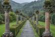 © VR - Historic garden with stone columns and symmetrical pathways, captured in soft daylight, showcasing the classical design and lush greenery.
