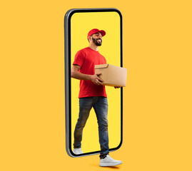 Arab Courier Guy Coming Out Of Big Phone Screen Carrying Parcel Box Delivering Package Over Yellow Studio Background. Delivery Service, Mobile App For Your Smartphone. Square Shot