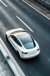 © dreamdes - Electric car moving through city highway. Autonomous driving concept. Modern transportation and innovation. Banner, poster, advertisement. Aerial view