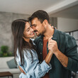 © Miljan Živković - Close up of adult couple boyfriend and girlfriend dance at home