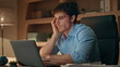 © stockbusters - Exhausted freelancer finish work closing laptop late evening close up. Tired man