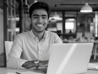 A person sitting in front of a laptop, focused on work or personal tasks