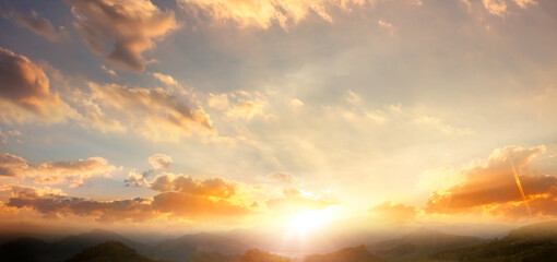 Wall Mural - panorama of beautiful sunset over the mountain range with clouds in the sky