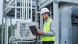 © The Little Hut - engineer using laptop checking industry cooling air conditioner water cooling tower air chiller of large industrial building to control air system at construction site : Generative AI