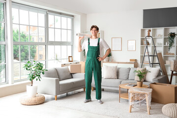 Sticker - Male worker with roll of stretch film in room