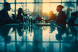 © sornram - Business meeting in boardroom with silhouettes of people discussing at sunset, reflections on table enhancing corporate ambiance.
