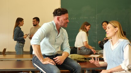 Sticker - Positive adult students communicating during recess between lectures in auditorium