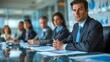 © Phichaphat - A focused business meeting in a modern conference room featuring professionals engaged in discussion and analysis.
