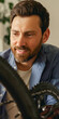 © Daria - Close up of handsome man in casual clothing lubricate the bike chain with oil at home