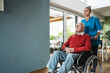 © Westend61 - Smiling nurse taking care of senior man sitting in wheelchair