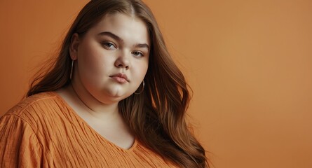 Poster - teen obese girl on plain orange background model portrait lifestyle hair skin care ad concept copy space