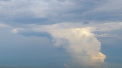 Wall Mural - The sky with a cloud that looks like a pillar sticking out of the ground. Unusual weather phenomenon.