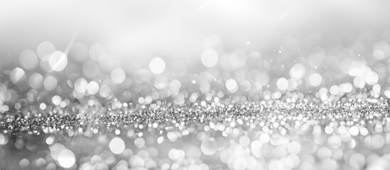 Leinwandbilder - Defocused monochromatic light background with an abstract silver glitter backdrop perfect for a copy space image
