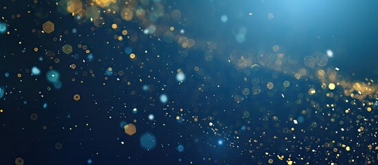 Poster - Prepare for the holidays with a trendy phantom blue background adorned with gold sparkles confetti and ample copy space image for text placement