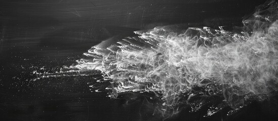Fototapete - Chalk dust creating an abstract pattern on a blackboard with copy space image available