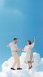 © Lustre Art Group  - Poster. Contemporary art collage. Carefree happiness. Joyful couple dances among clouds against blue sty. Love and romantic. Concept of art, disco, party, retro fashion, happy and fun. Vintage.
