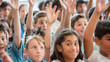 © ArtsybitDesign - A group of students eagerly raises their hands to answer a question posed by their teacher, demonstrating their engagement and thirst for knowledge.