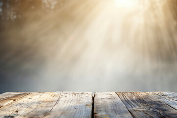 Poster - Empty wooden table top with blurred nature background, ready for product display montage
