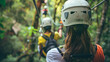 © Daniel - Child in safety harness conquer heights on rope ladder at adventure park.