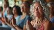 © Buzz Media - Yoga for Middle aged women. Adults and seniors at yoga class lesson. Inspirational Elderly females