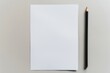 © evgenii - Mockup of white horizontal sheet of paper with pencil, letter or invitation. Blank note template on A4 paper with soft shadows isolated on light gray background. Business card. Copy space. Banner