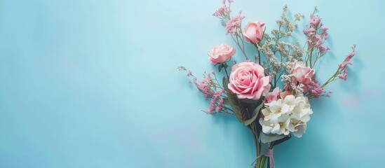 Poster - Spring bouquet on pastel blue backdrop with copy space image for spring celebrations Floral minimalist composition for photo banner