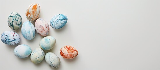 Aufkleber - Minimalistic flat lay of marbled painted eggs on a white background with copy space image