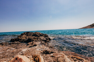 Wall Mural - A blue transparent sea in the mountains