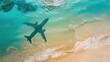 © NAPATT - A travel-themed image showing the shadow of an airplane cast over a serene beach, with turquoise waters and soft sand, evoking a sense of adventure and wanderlust.